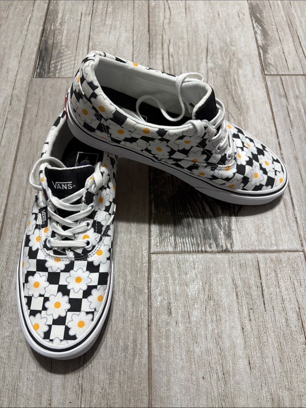 Vans Black & White Checkerboard Daisy Sneakers with Yellow Centers